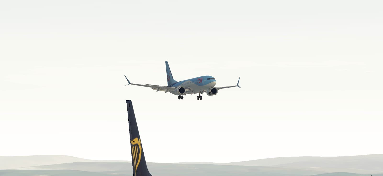 A TUI Boeing 737 MAX on approach above the tail of a Ryanair Boeing 737
