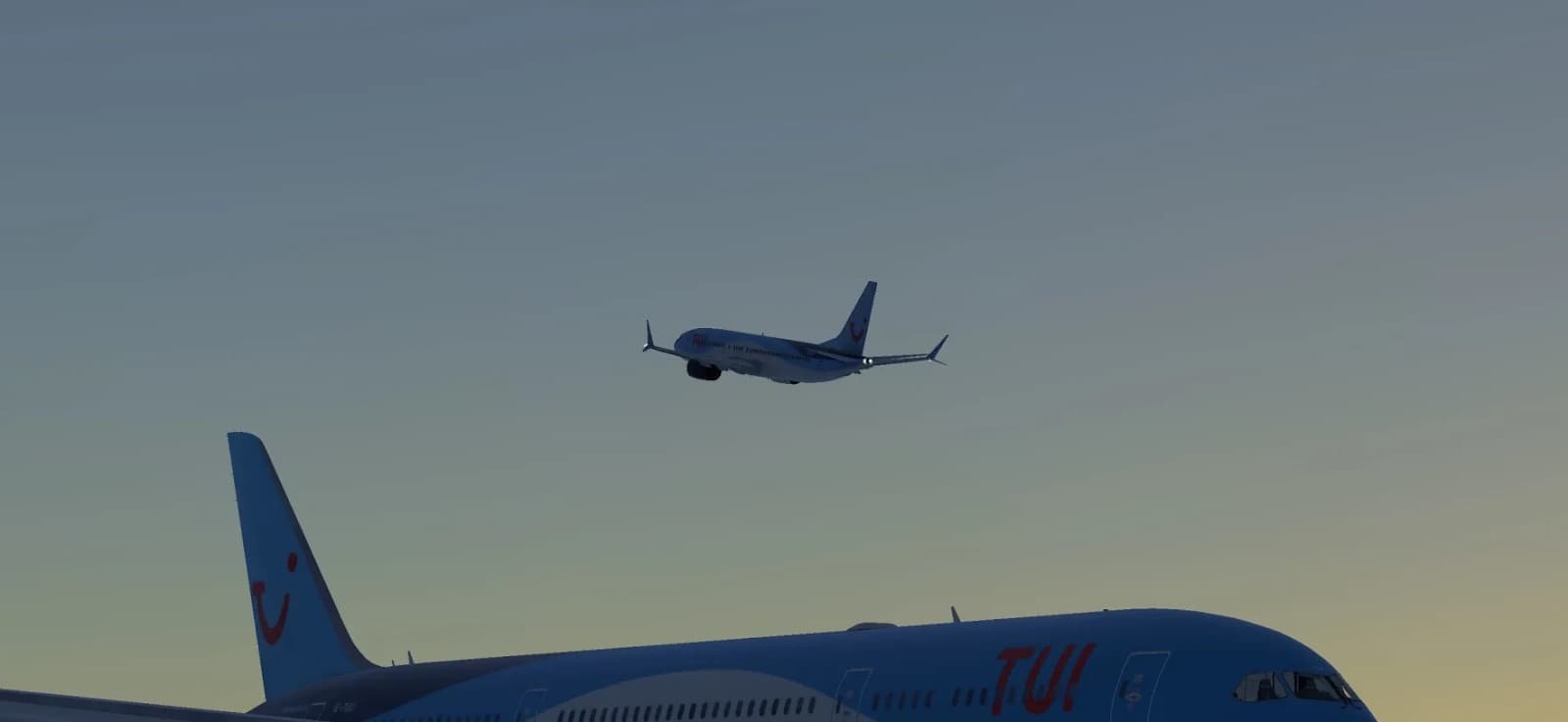 A TUI Boeing 737 departing at sunset over a parked TUI Dreamliner